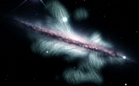 Breathtaking Impression Reveals The Colossal Magnetic Industry of a Distant Spiral Galaxy