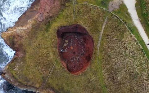 Growing hole in the UK reveals a hidden beach below