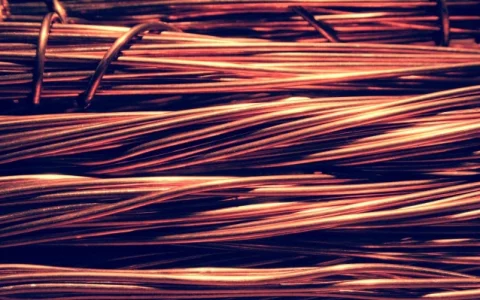 Copper closes lower with strong dollar amid Fed caution